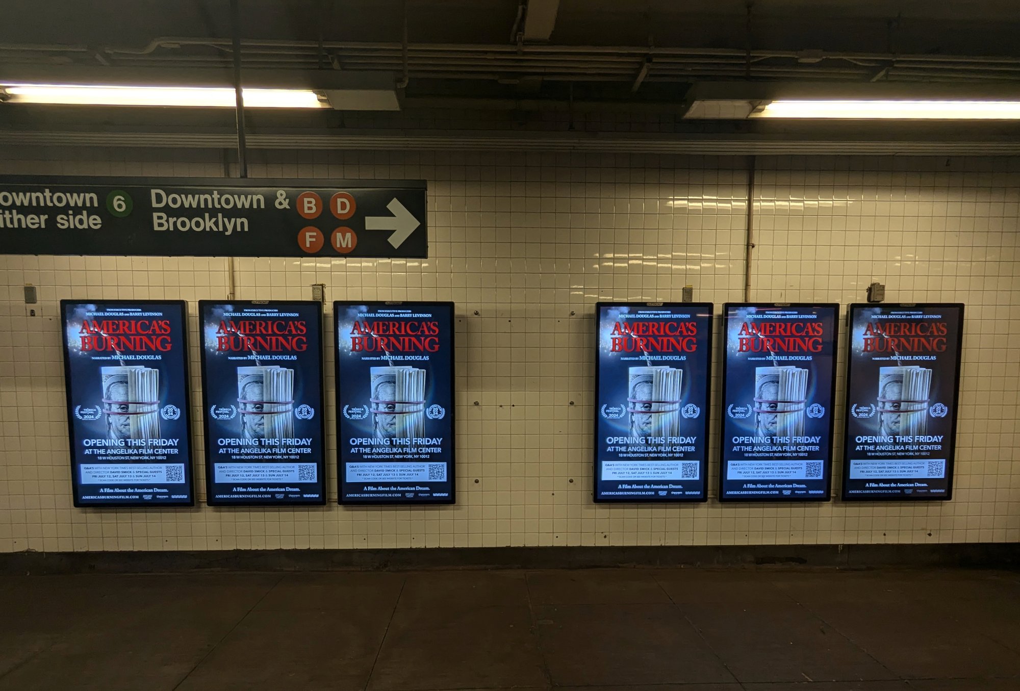 America's Burning subway digital liveboards along Downtown 6, B, D, F, M platform in New York