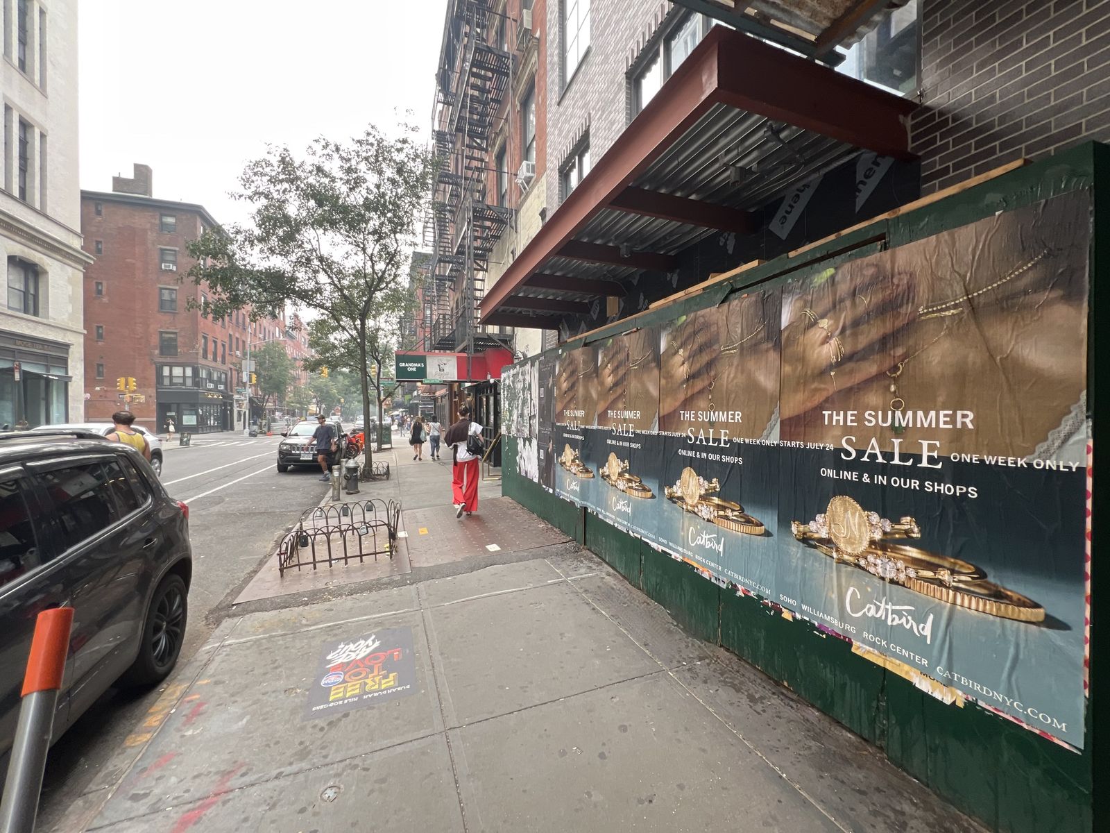 Catbird Summer Sale wild posting installation on 160 Bleecker Street in Greenwich Village, Manhattan