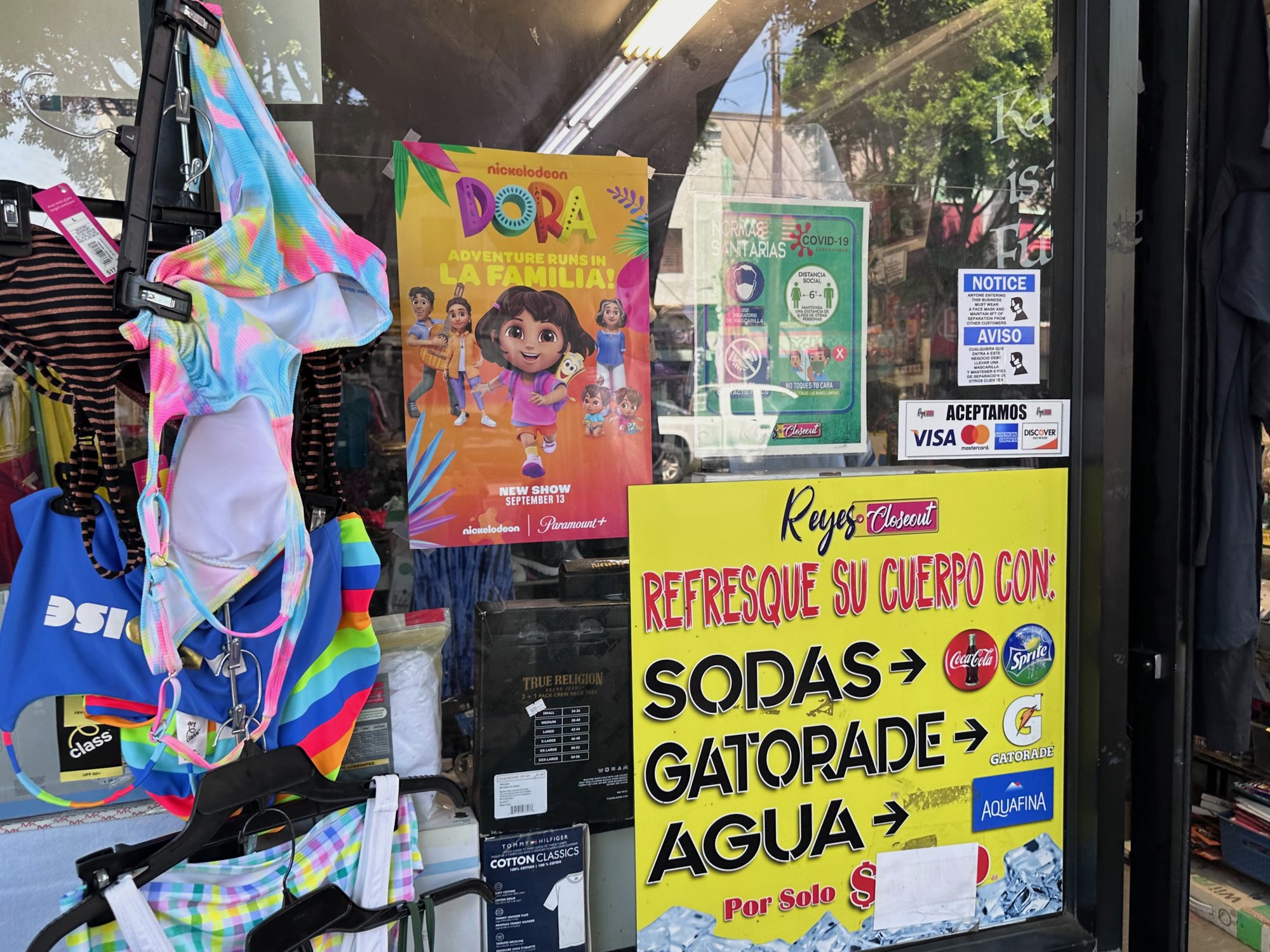 Nickelodeon Dora retail poster at Reyes Closeout clothing store, Cesar E Chavez Avenue, East Los Angeles