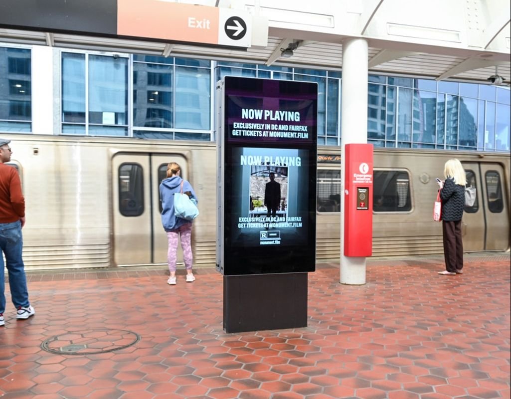 Monument now-playing creative on a DC Metro platform LIVEBOARD