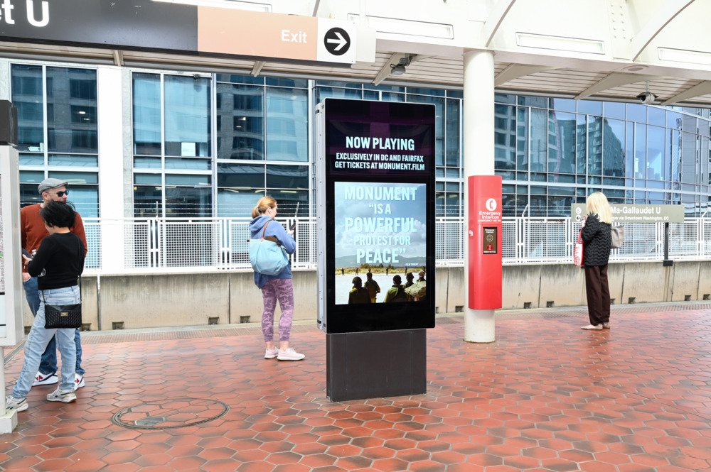 Monument 'Powerful Protest for Peace' pull-quote creative at NoMa-Gallaudet U station