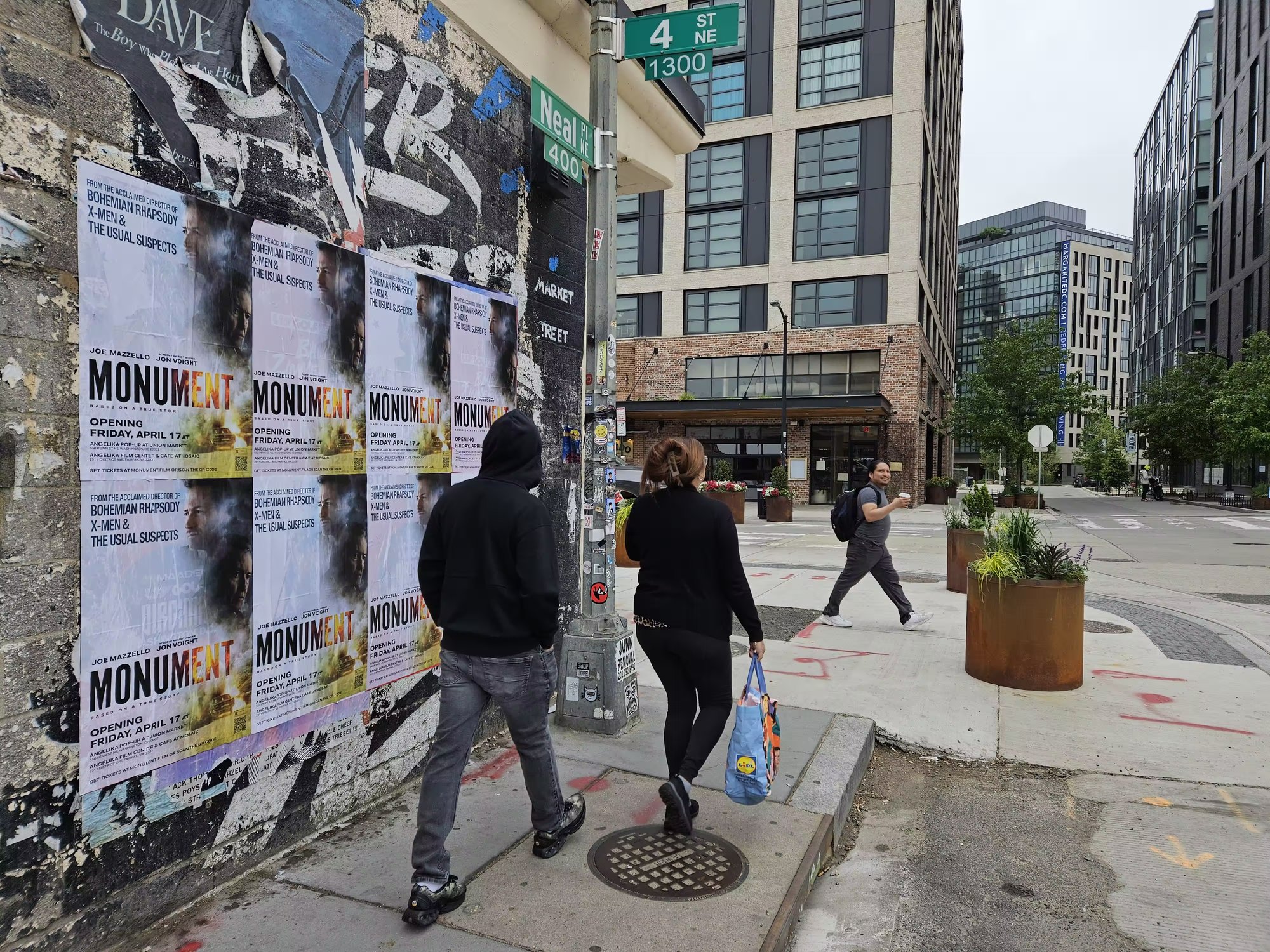 Monument wild posting on a NoMa pedestrian corner, Washington DC